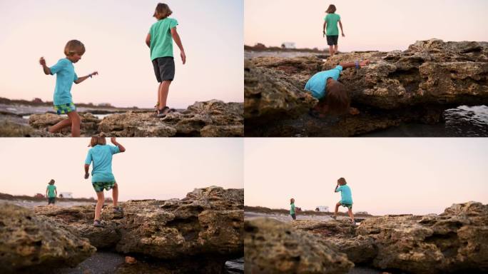 两个男孩熟练地探索岩石海边，在风和阳光下揭开它的秘密。