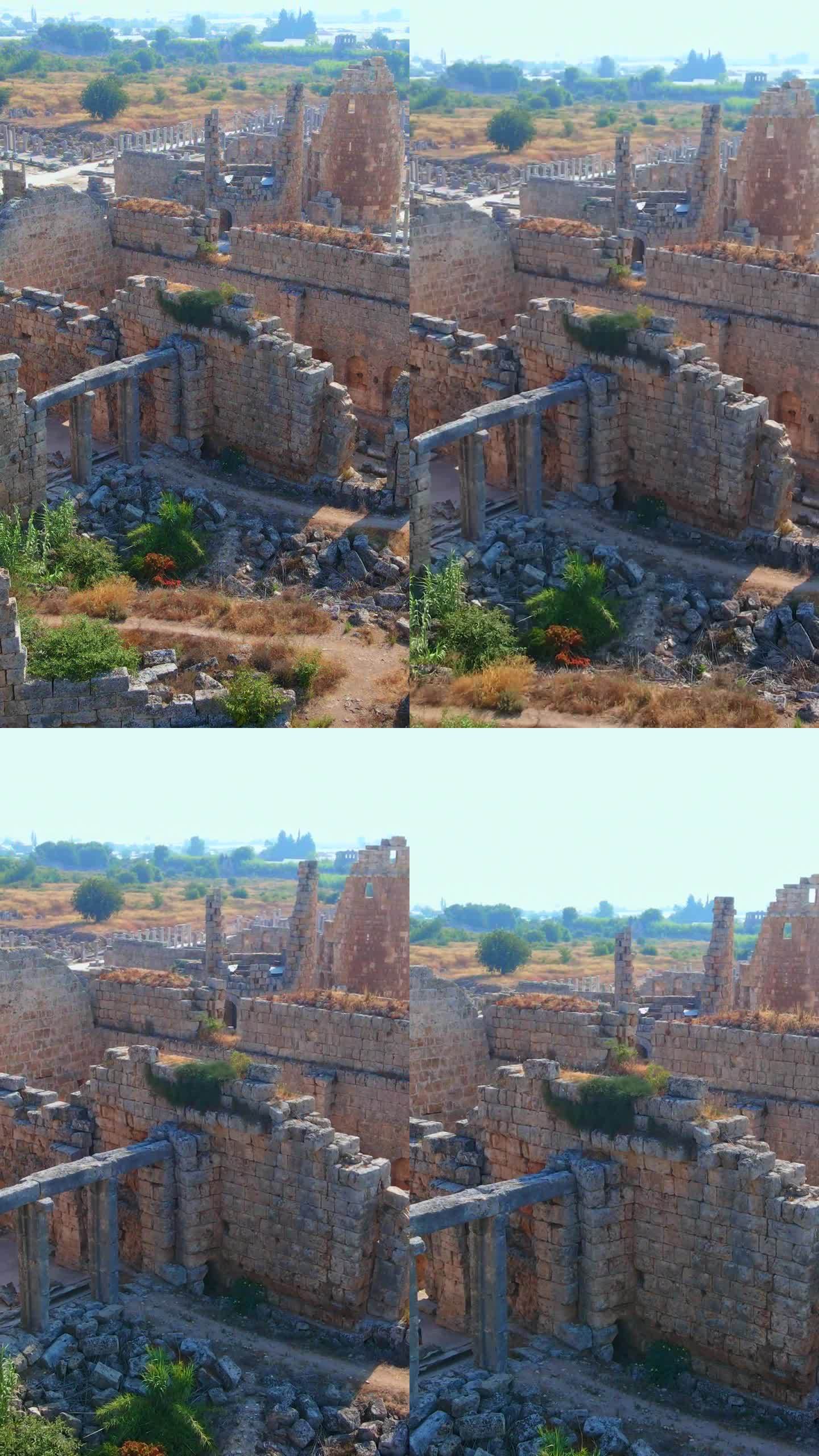 垂直视频。故事的格式。在这个迷人的空中库存视频中，展示了土耳其安塔利亚当代城市佩尔热古城的非凡废墟。