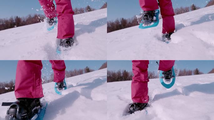 超级慢动作，低角度视角:女性穿着雪鞋向镜头跑去