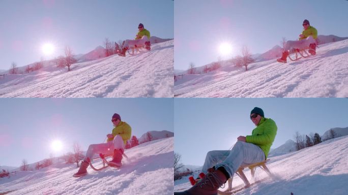 慢镜头，镜头光晕:一个家伙带着灿烂的笑容骑在木制雪橇上