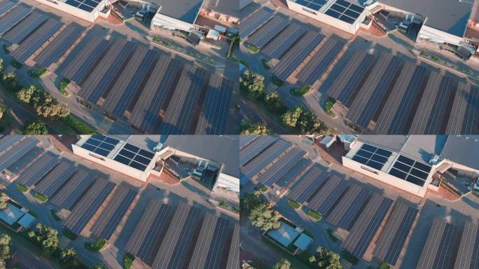 空中平移。在南非的一个购物中心，太阳能电池板提供了一个阴凉的停车场。气候变化，全球变暖，绿色可再生能