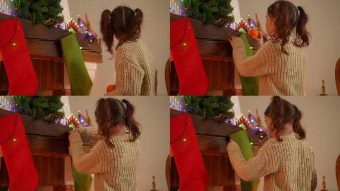 这个女孩偷偷地把一个橘子放在壁炉上方的圣诞袜里，这样就没有人能看到了。