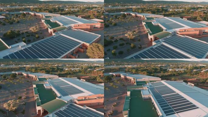 空中飞行。南非购物中心屋顶上的太阳能电池板。气候变化，全球变暖，绿色可再生能源。