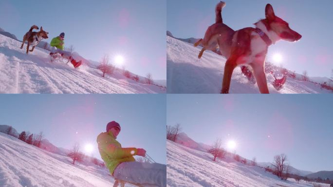 慢镜头，镜头光晕:一个阳光明媚的冬日，一个年轻人在雪橇上微笑