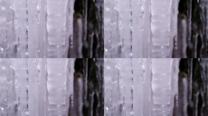 超慢镜头，微距镜头，深度镜头:从融化的冰柱上落下的水滴