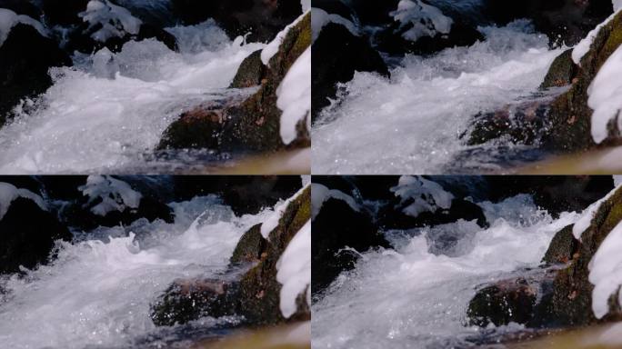 超级慢动作，特写:一条小山溪的活泼和飞溅的流动