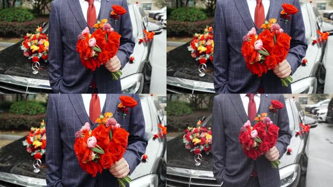 男人手里的红色鲜花手捧花