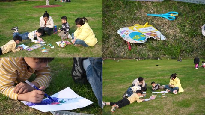 4K孩子在妈妈的陪同下在草坪上画画