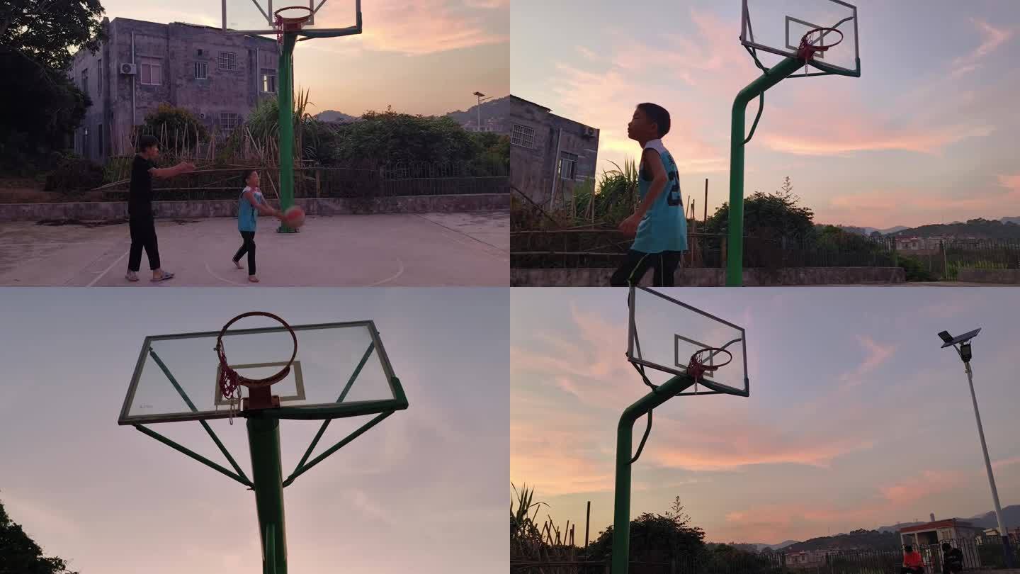 乡间篮球场农村傍晚红霞留守儿童打篮球投篮