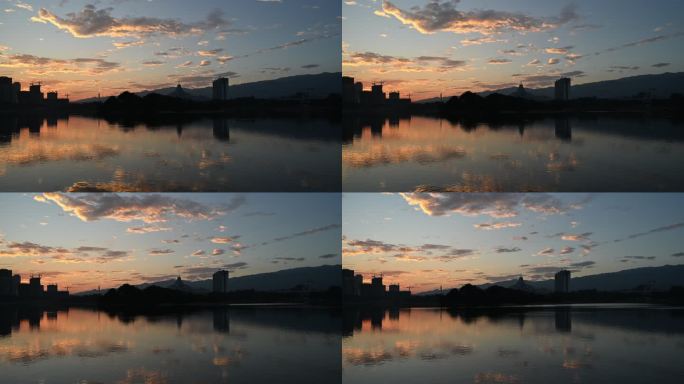 晚霞映照在金色湖面上的延时风景