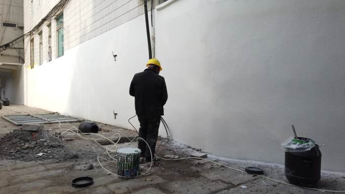 油漆工喷涂真石漆建筑墙壁白墙面装修