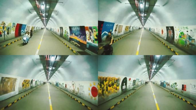 行驶在满是涂鸦的隧道里