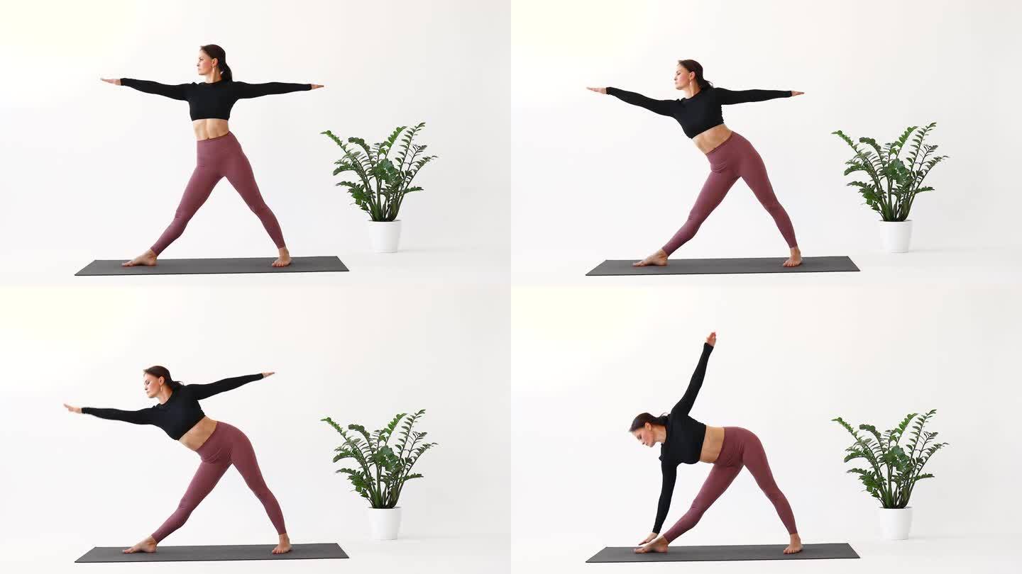 一名妇女以健康的生活方式练习瑜伽，做三角体式，在房间里穿着运动服站在垫子上独自训练