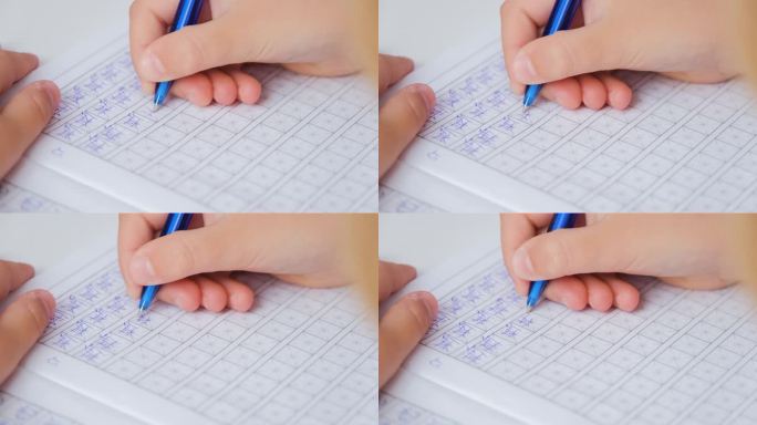 孩子的手在写象形文字