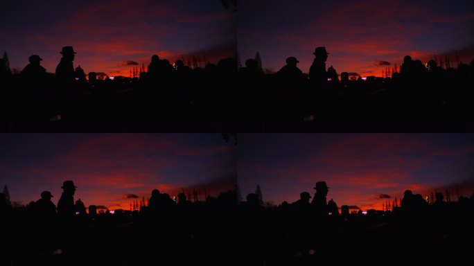 夕阳下拍照的人剪影