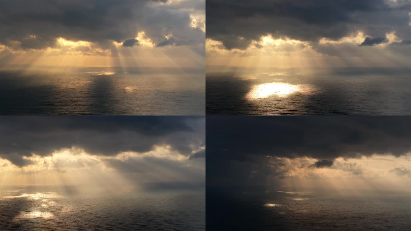 阳光穿过乌云照在大海上