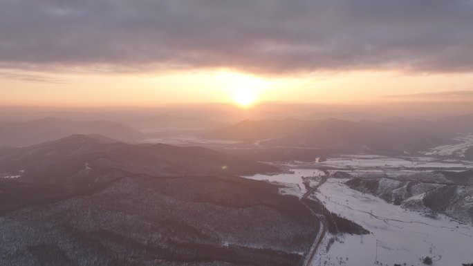 航拍寒冬山区山林雪景暮色