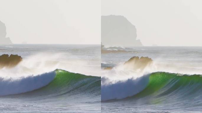 巨大美丽的波浪在海岸线上破碎，而微风吹着海水吐出海面——垂直视频