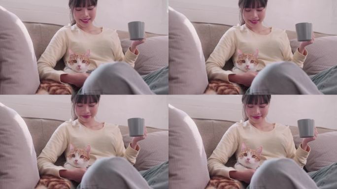 亚洲女人啜着咖啡，深情地抚摸着她的橙色猫，在家里营造出快乐和爱的氛围。捕捉咖啡、宠物陪伴和欢乐的愉快