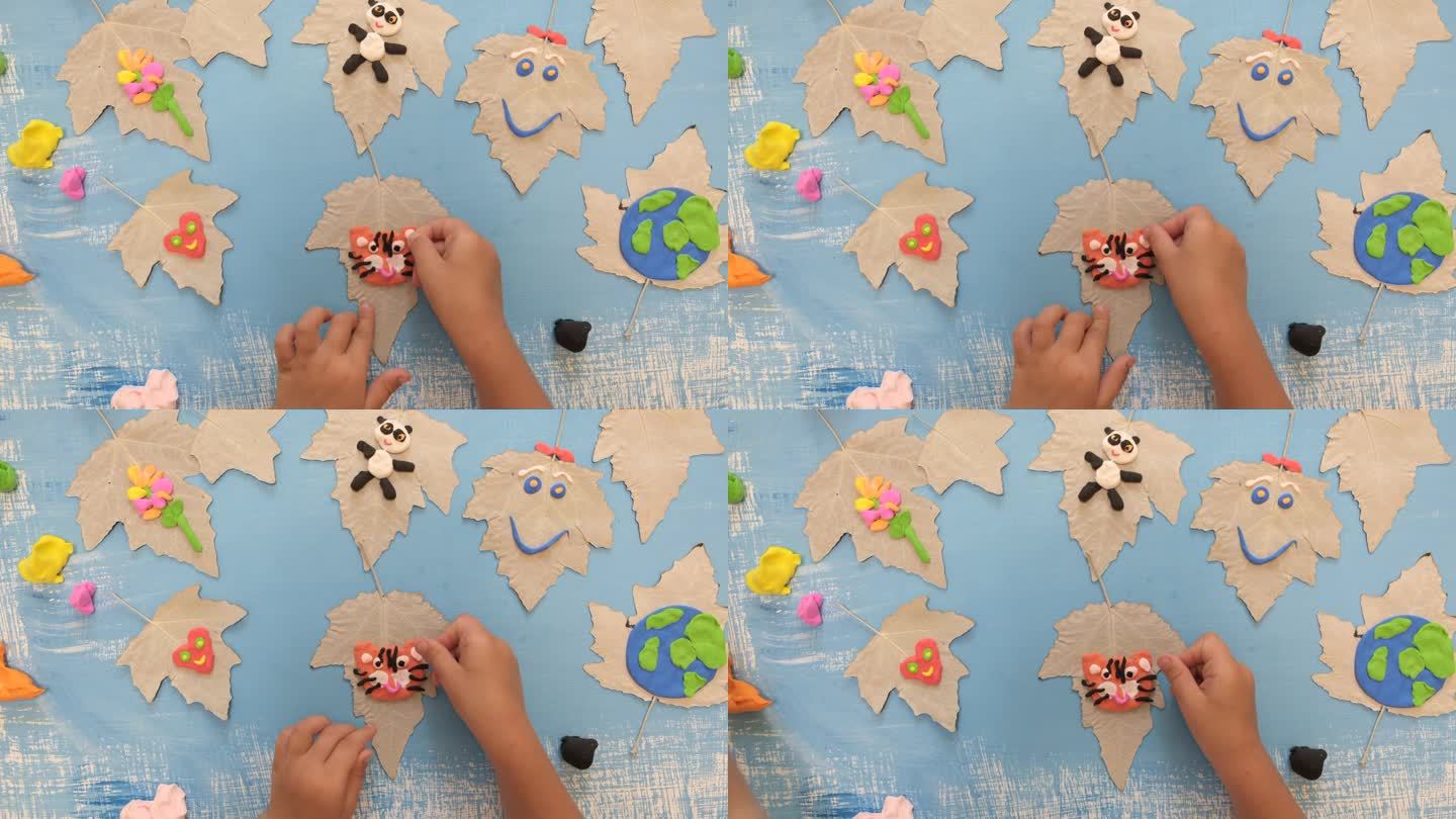 孩子们为地球日雕刻橡皮泥星球。保护环境，拯救地球。生态学的概念。艺术学习与教育理念;
