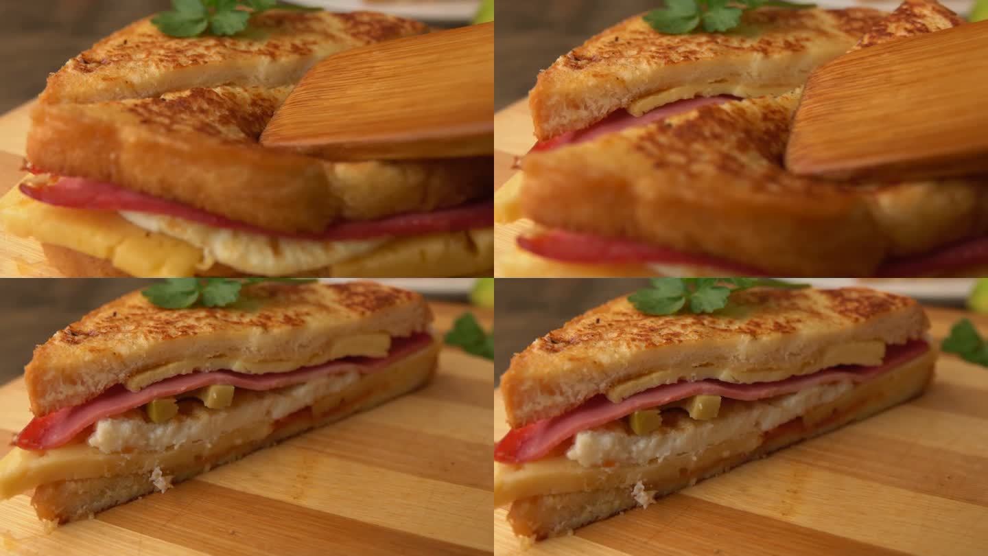 超近距离观看从板上拿走的一半美味的三明治