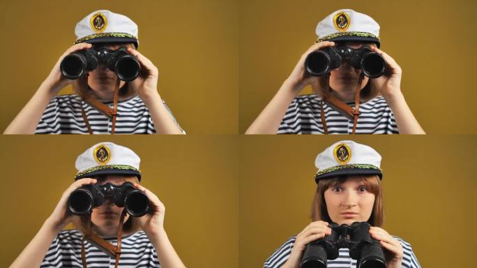 一个戴着水手帽的兴高采烈的少女正通过双筒望远镜观看