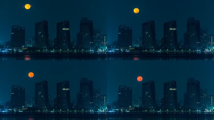 深夜的城市月亮悄悄穿过高楼建筑天际线