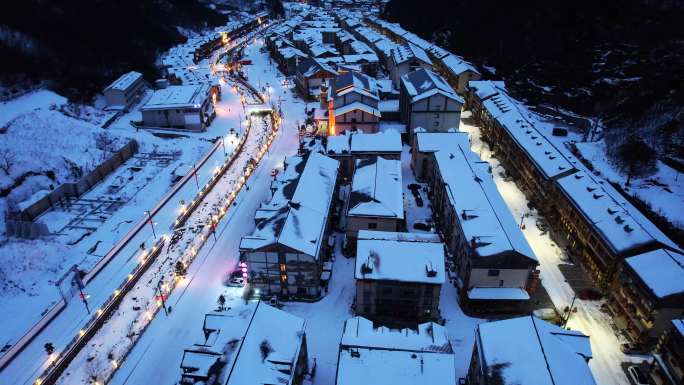 航拍冬天湖北神农架山谷小镇夜晚灯光雪景