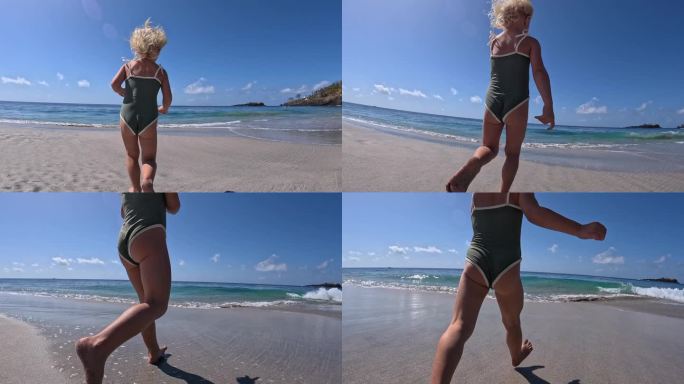 穿着泳装的快乐微笑的女孩跑向蓝色的海洋的特写。动态视频在海滩上的孩子在泳衣嬉戏，跑到海里游泳。概念带
