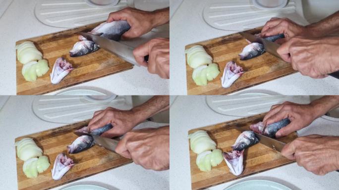 主厨亲手将新鲜的海鲈鱼切成片