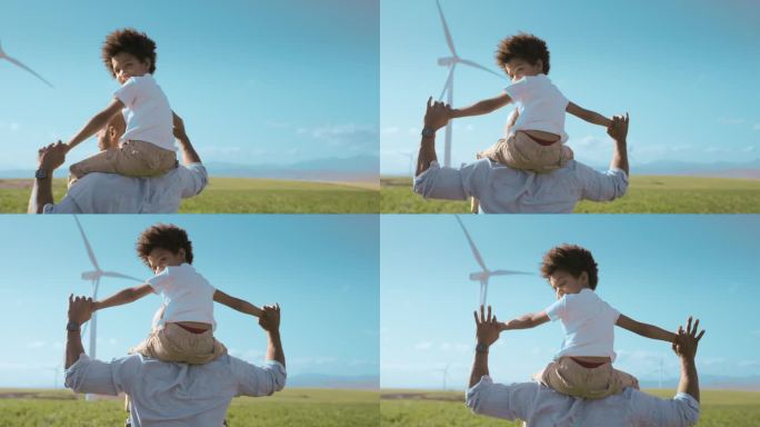 背着，爸爸或孩子在风电场，大自然或乡村散步的支持，关心或爱。风车，面对或背后的父亲与孩子享受一个有趣