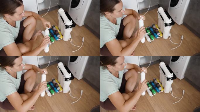 一名妇女拧动塑料配件，迅速将管子固定在滤水器上。他们坐在地板上自己换过滤器。