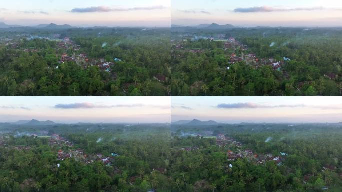 鸟瞰图，一个村庄的燃烧活动产生的烟雾。重度雾霾和PM2.5覆盖地区。空气污染和生态问题