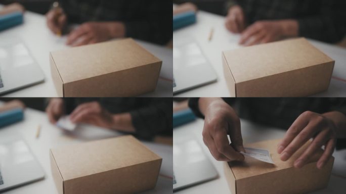 小企业主填写发票，在箱子上贴标签，包装订单