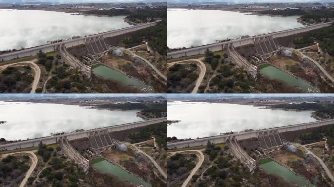 西班牙巴伦西亚省用于灌溉和蓄水的Bellús重力坝的无人机视频，安全阀满负荷工作