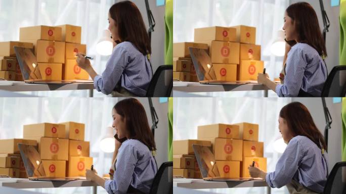 亚洲女商人，一家网上购物公司的老板，在家工作，打电话给客户，检查包裹箱是否有货物送达。