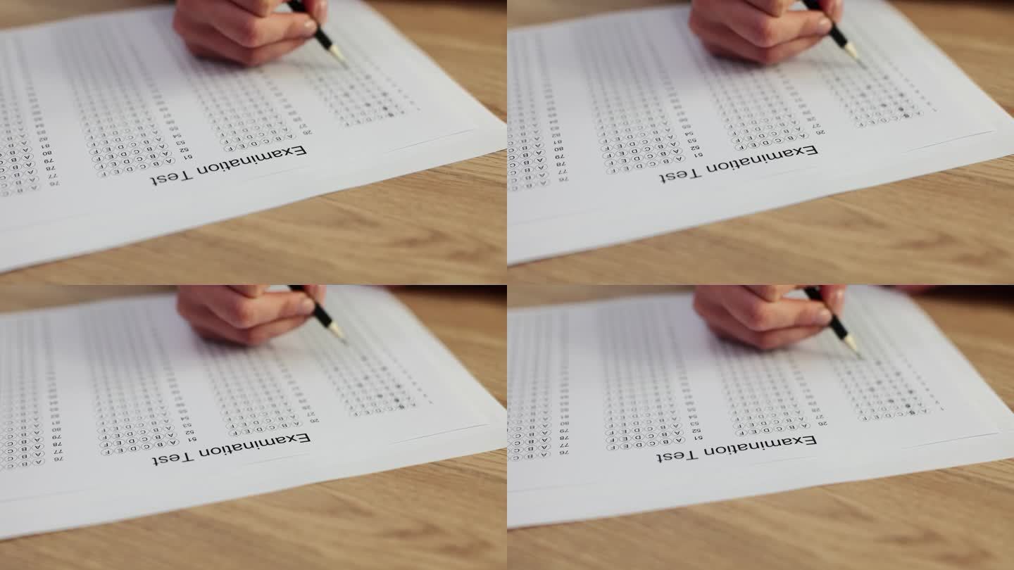 一名妇女手持铅笔，在答题纸上写下选择题
