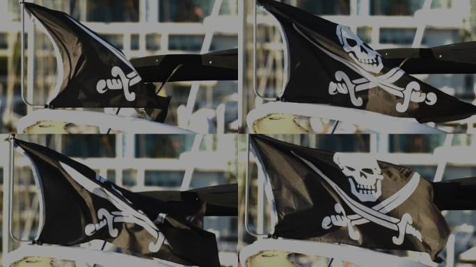 黑色海盗旗，骷髅和交叉的剑飘扬。