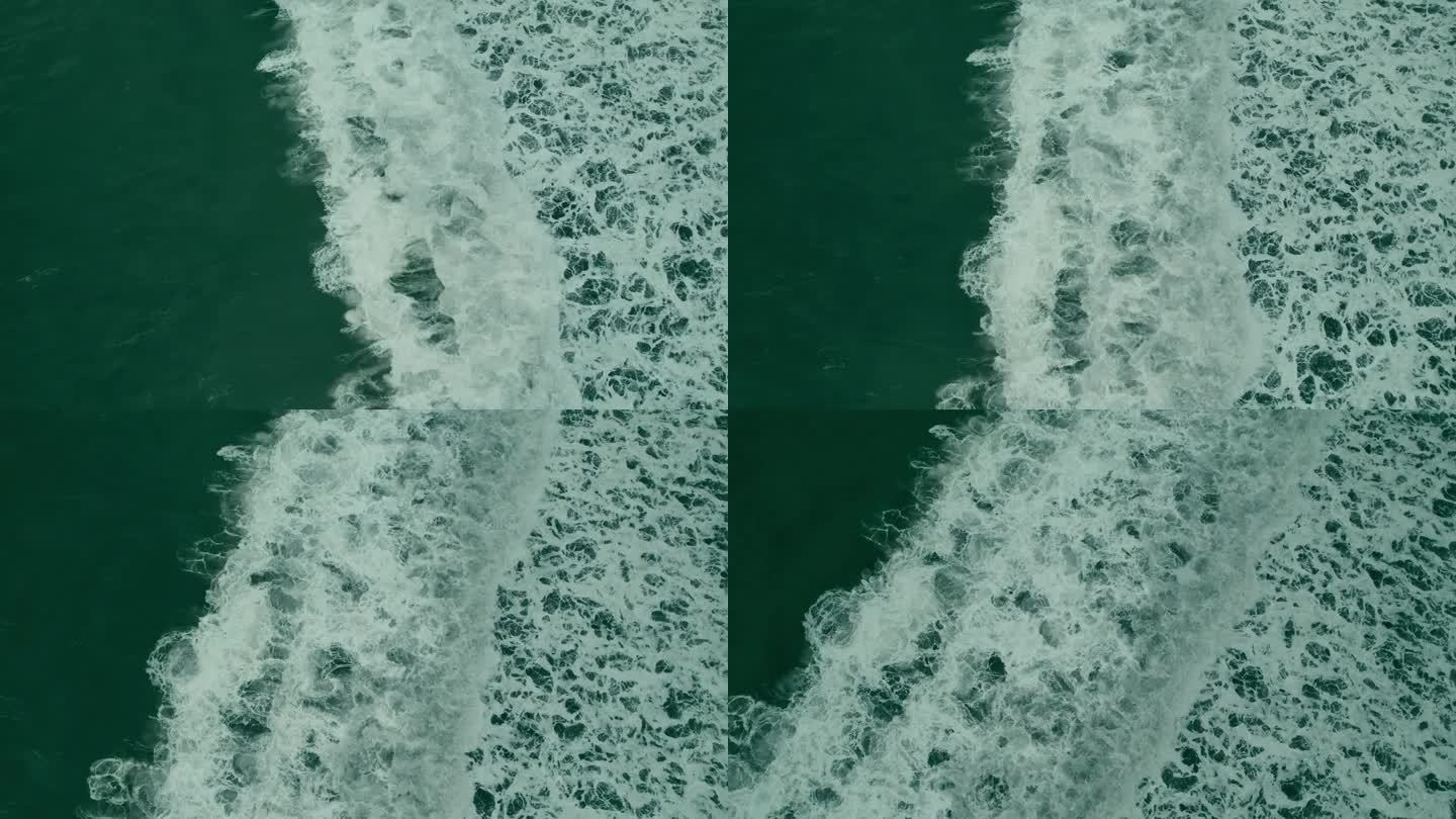 巨浪翻滚着，从上面冒着泡沫。自顶向下的进步4K无人机，哥斯达黎加视图