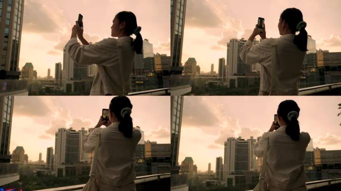 亚洲女性游览泰国曼谷市中心欣赏日落时的摩天大楼