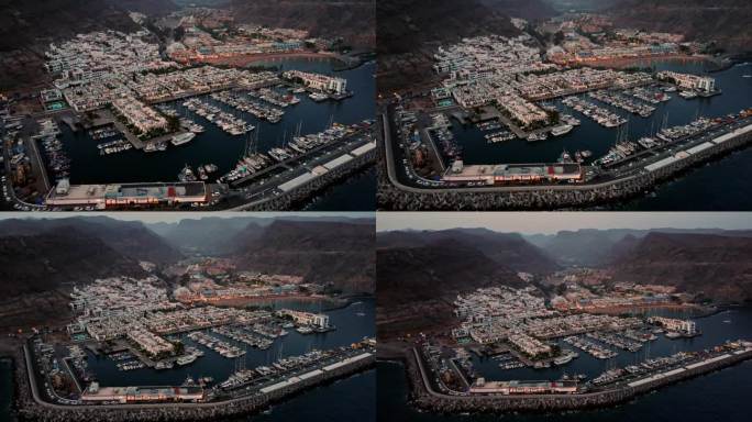 在大加那利岛Mogán镇的港口地区，有码头，房屋和船只。