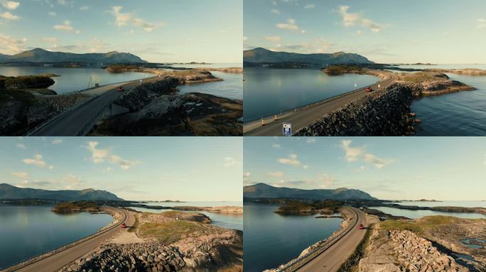 无人机跟随一辆红色SUV行驶在著名的大西洋公路上，景色壮丽的挪威。