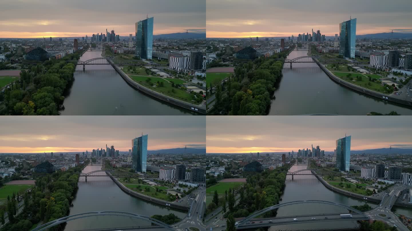 鸟瞰实时镜头的法兰克福美因天际线，虽然美因河和现代金融大楼和摩天大楼与德国大桥和欧洲中央银行日落时间
