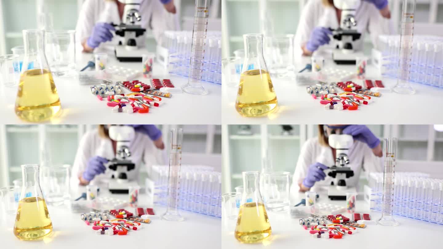 实验室里的一瓶尿液，一堆药片和科学家