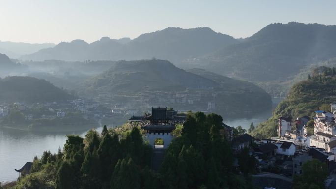 航拍湖南湘西芙蓉古镇酉水河村落夕阳光束