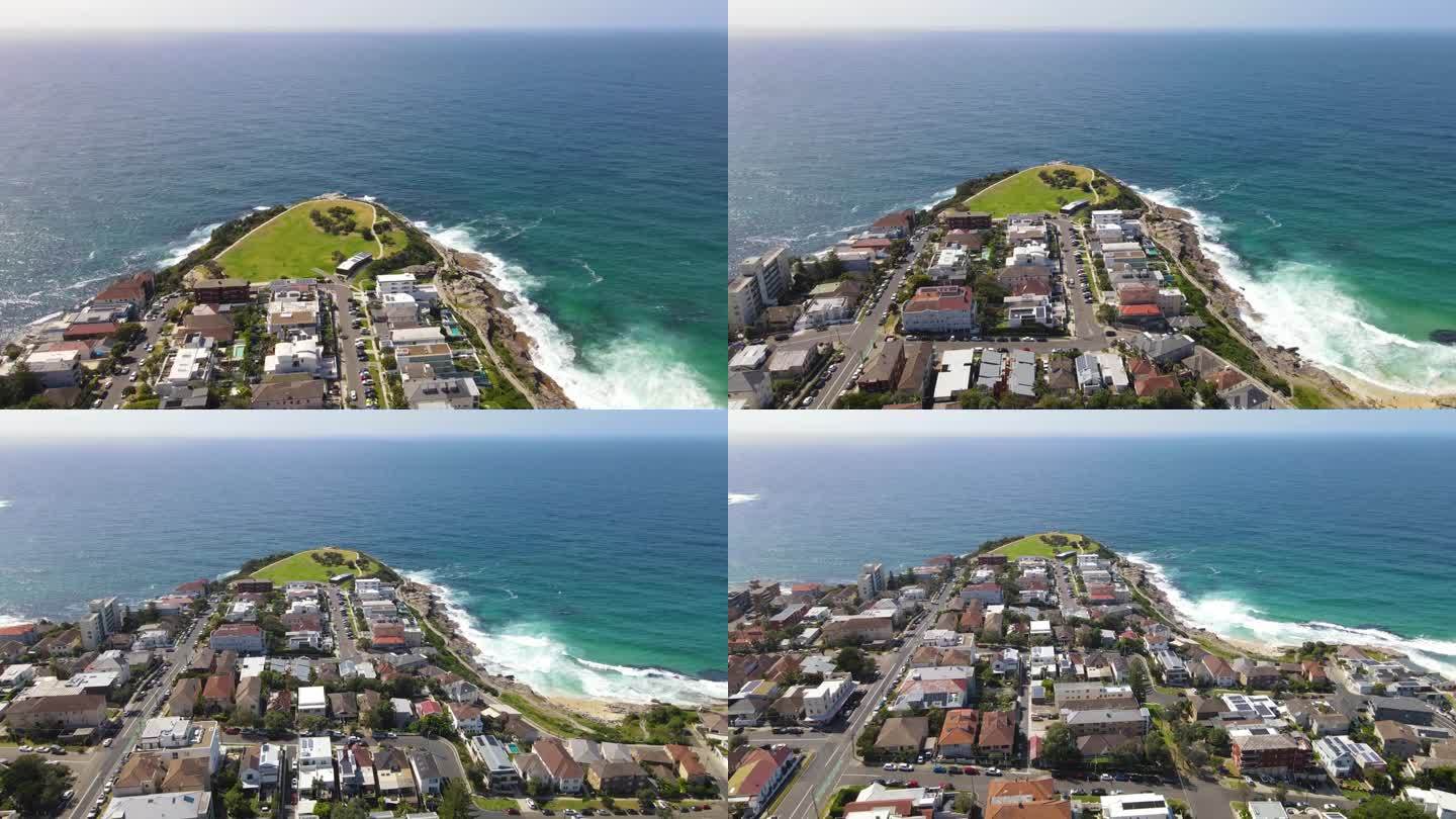 在新南威尔士州的悉尼东部，无人机拍摄了塔玛拉玛海滨郊区的房屋和街道的反向视图，朝向马克斯公园