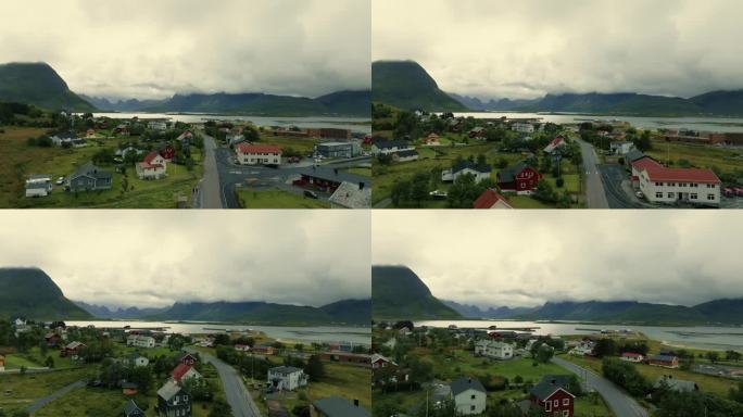 无人机飞过斯堪的纳维亚小镇，飞向云层中美丽而强大的北欧峡湾。
