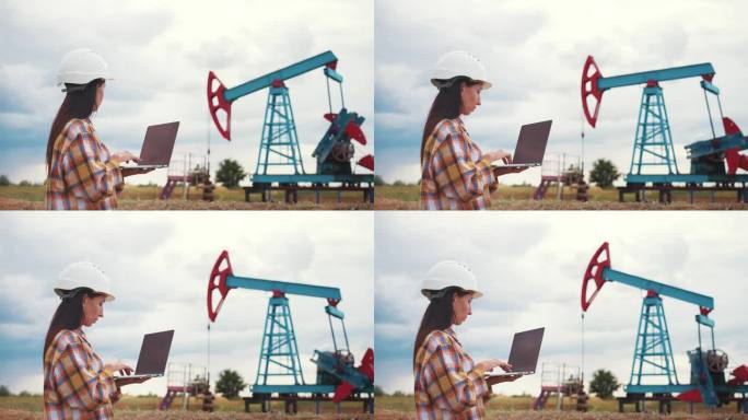 石油工业。工程师站在油田钻井站旁边，用笔记本电脑在键盘上输入文本。石油生产企业财务概念。天然气生产。