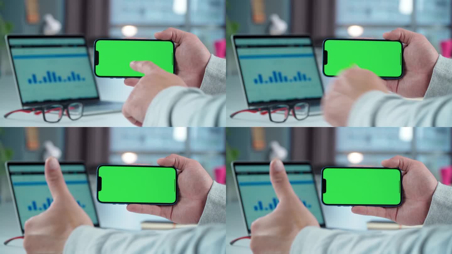手机的特写与绿色的模拟屏幕在男人的手在桌面背景。男子轻触智能手机显示屏，显示课堂手势