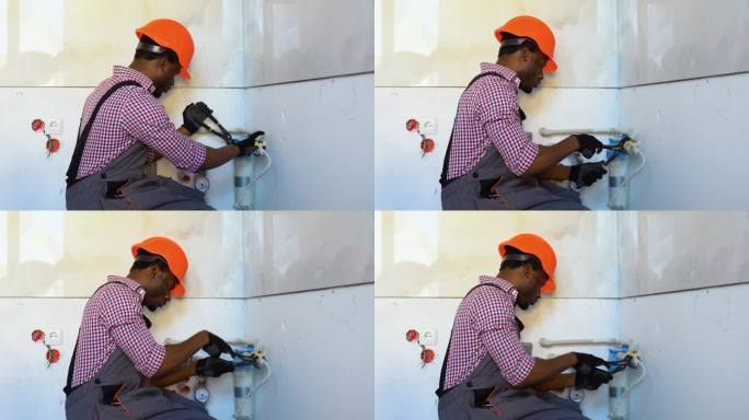 黑色水管工在新公寓安装或更换滤水器